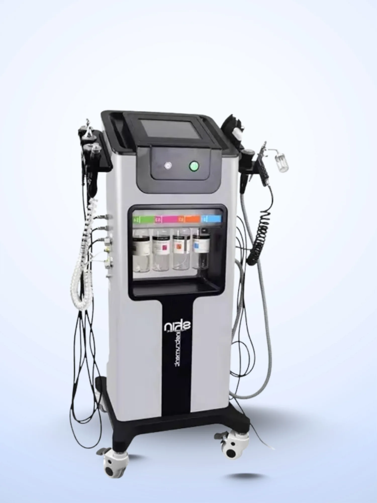 A clinical product shot of the multi functional skin cleansing and hydra dermabrasion station displaying multiple treatment handpieces and serum bottles against a plain background